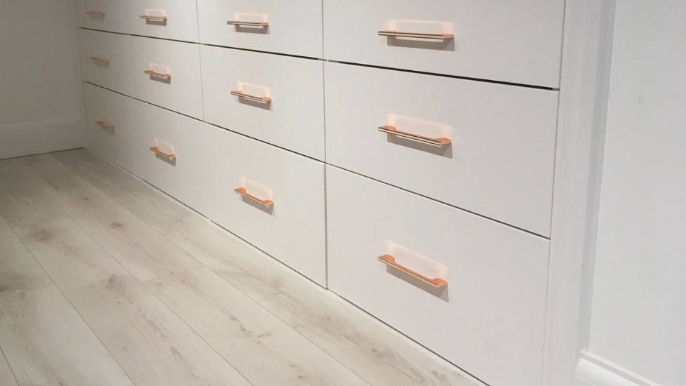 Loft conversion with cupboards, hanging rail and drawers